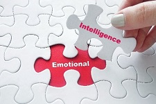 Puzzle pieces fitting together displaying "emotional intelligence."