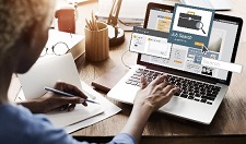 Person at a computer using a job seeking webpage.